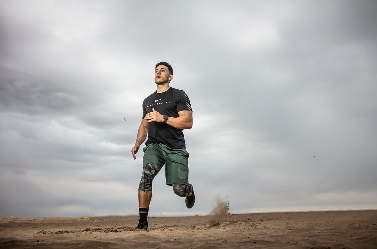 An athlete running, recovered and pain-free